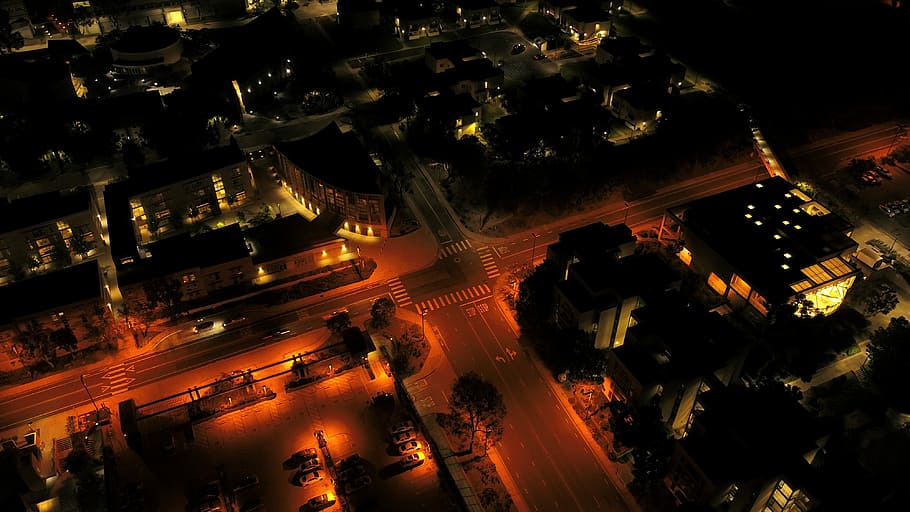 aerial photography of lights turned on at street and buildings at night, aerial photography of cityscape during nighttime