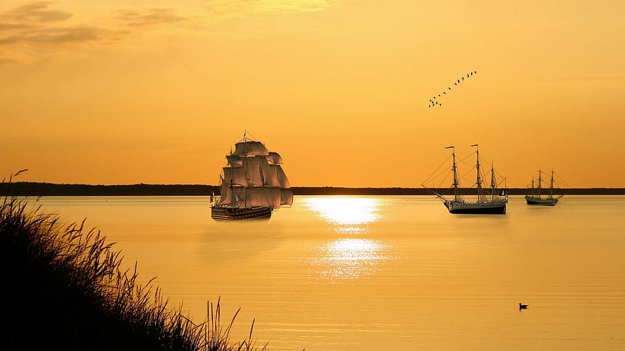 sailboat on body of water under yellow sky, sunset, waters HD wallpaper