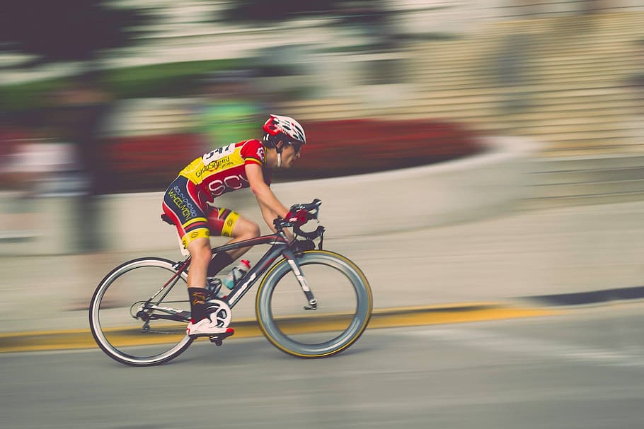 man in yellow and red on bicycle, blur, sport, bike, competition, HD wallpaper