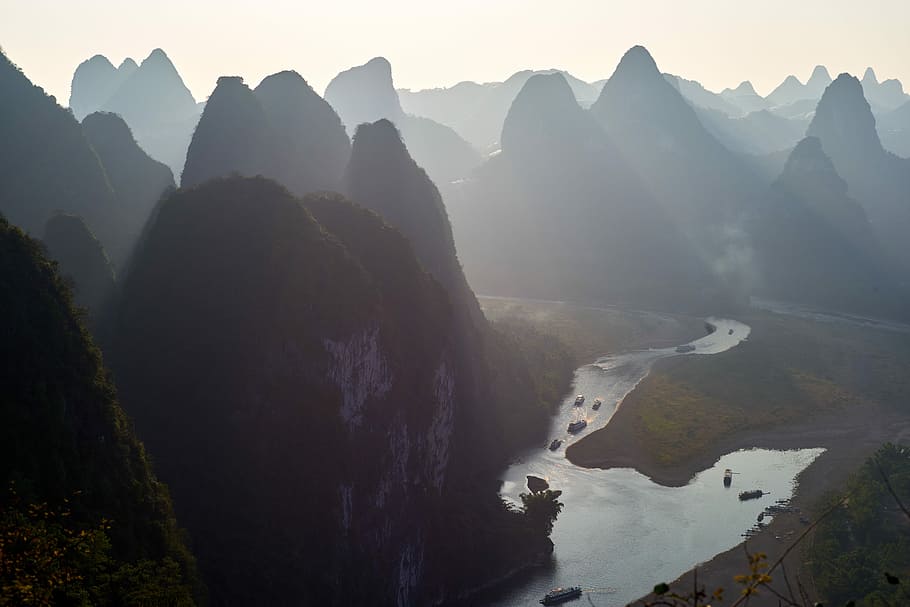 silhouette of rock formation and river during daytime, aerial photo of river HD wallpaper