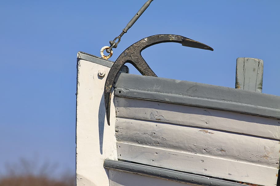black boat anchor on white boat photography during daytime HD wallpaper