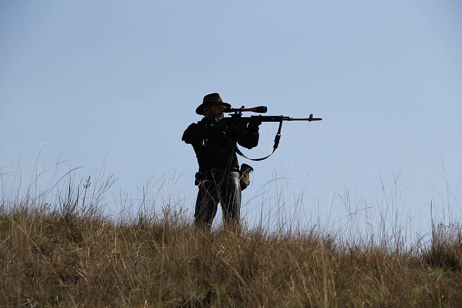 man holding rifle while sighting target, pistol, gun, hunter, HD wallpaper