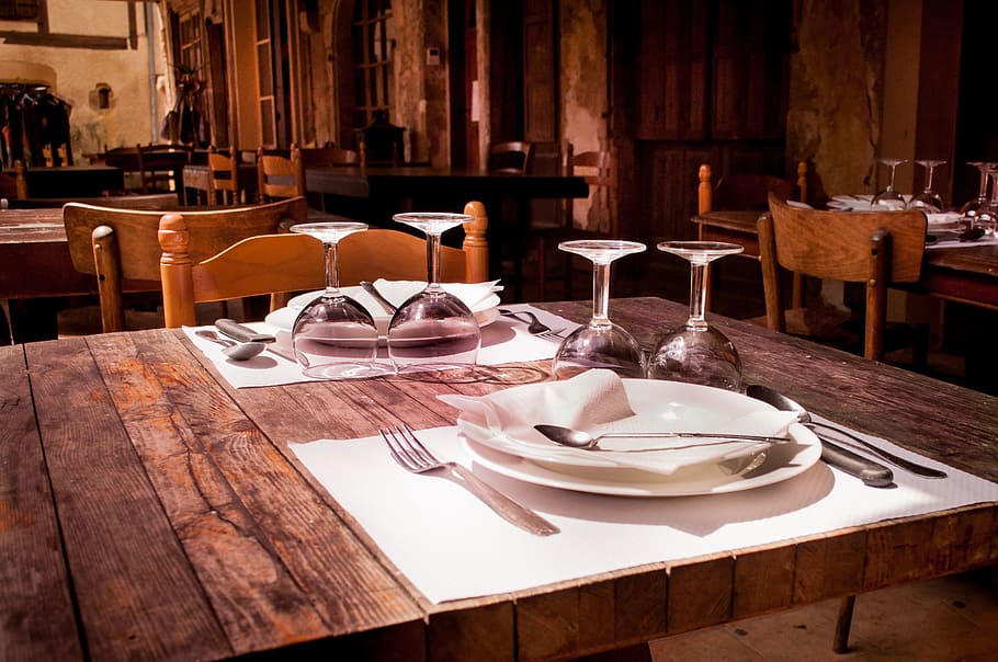 rectangular brown wooden farm table with plates and wine glasses HD wallpaper