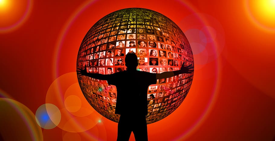 silhouette of man in front of sphere with photo of people, hug