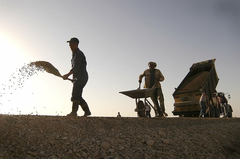 man pushing wheelbarrow, construction, workers, shovel, dump truck