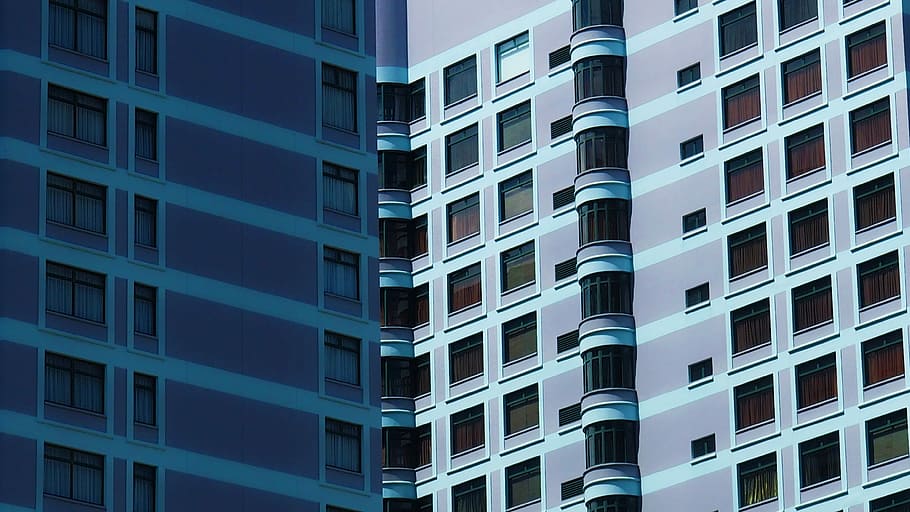 pink and black building, optical illusion photograpy of two blue high-rise buildings HD wallpaper
