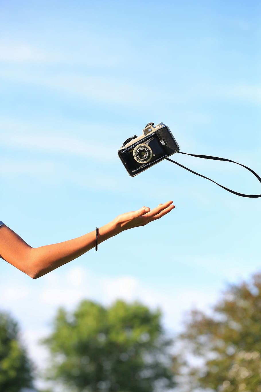person catching black film camera during daytime, person catching camera HD wallpaper