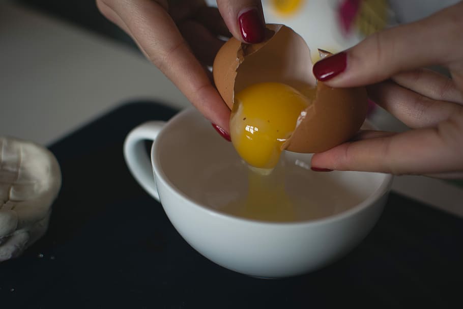 Cracking an egg, close up, cooking, eggs, hands, process, food