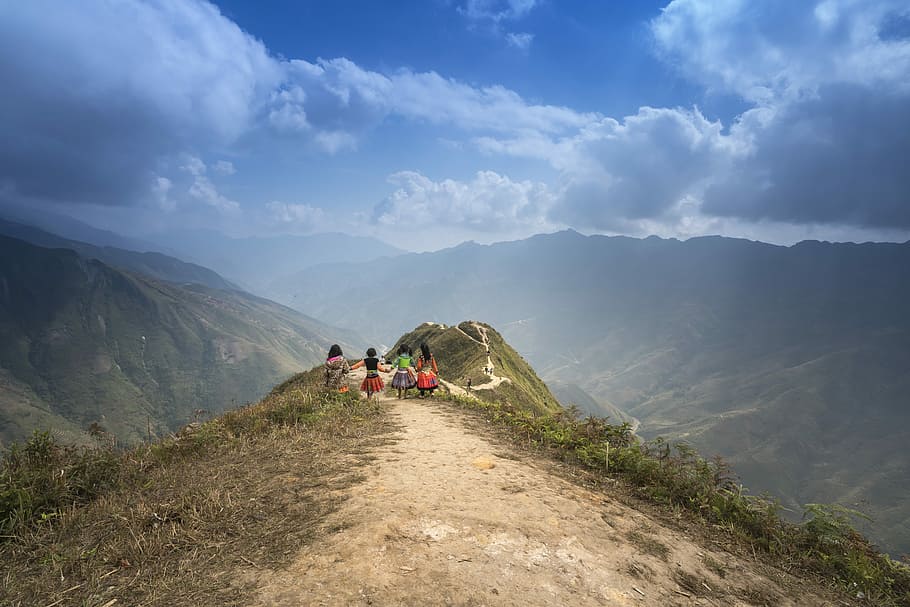 four girls standing on top of mountain, vietnam, ha giang, street