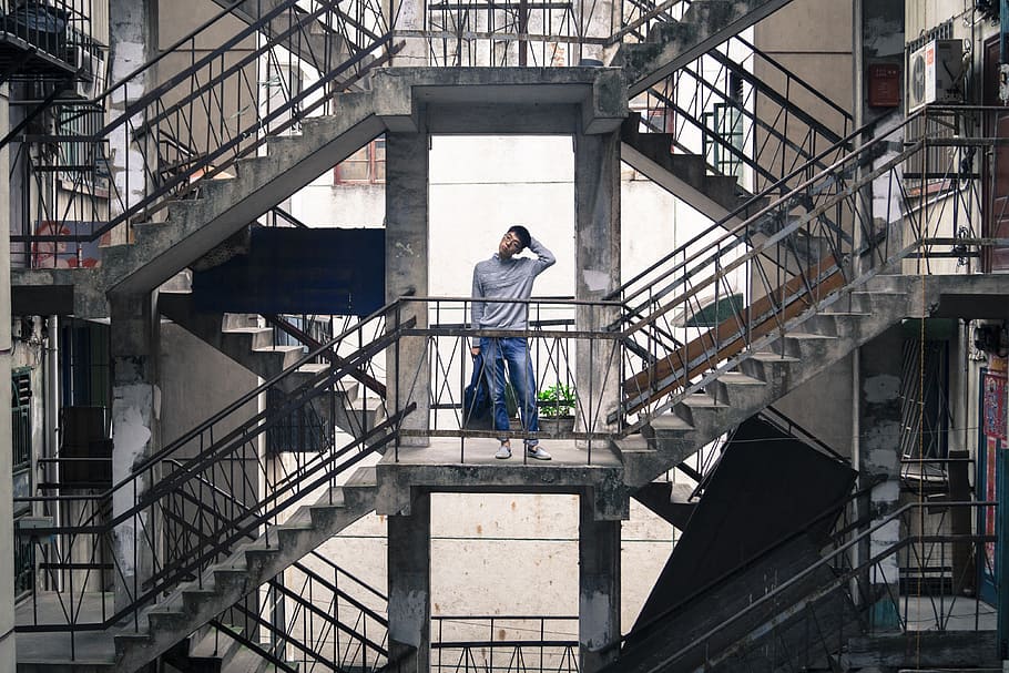 man standing on second floor of building, portrait, the self-timer, HD wallpaper