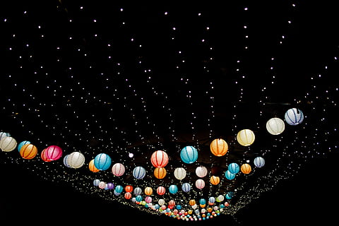 assorted-color Japanese lantern lot with black background, multicolored sky lantern during nightime HD wallpaper