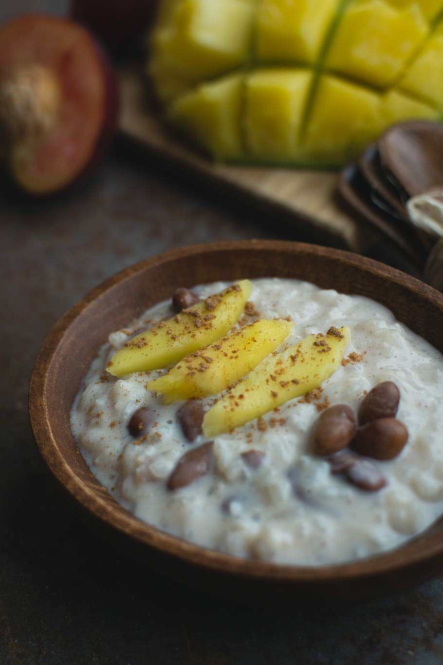 Exotic coconut rice and beans dessert with mango, cinnamon, close up HD wallpaper