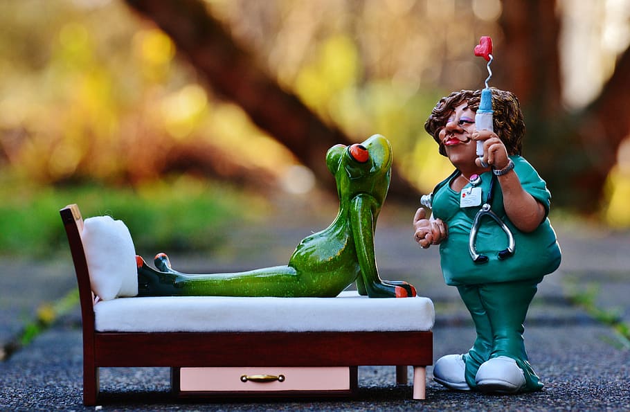 red-eyed frog ceramic figurine on bed, nurse, sweet, decoration