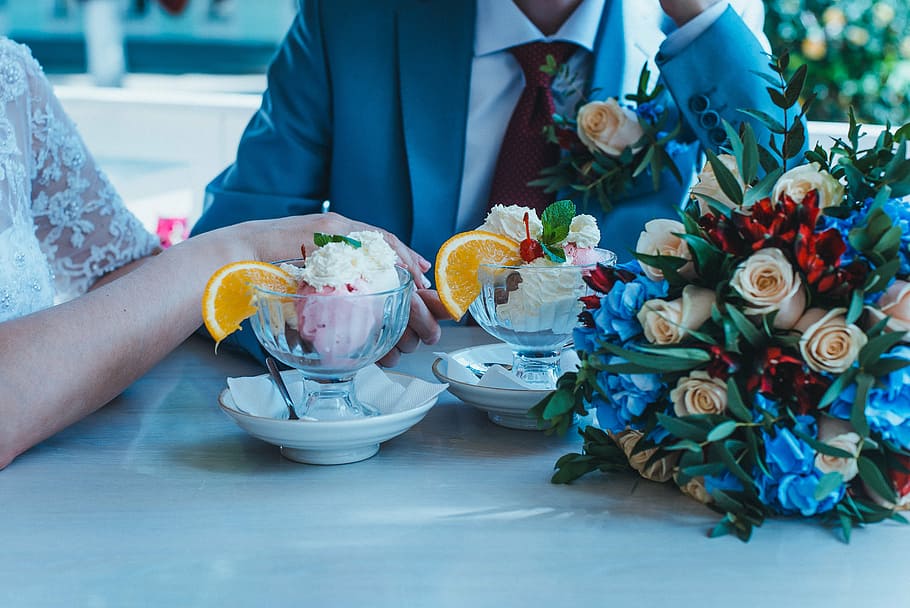 man and woman sitting beside table, bouquet, love, wedding HD wallpaper
