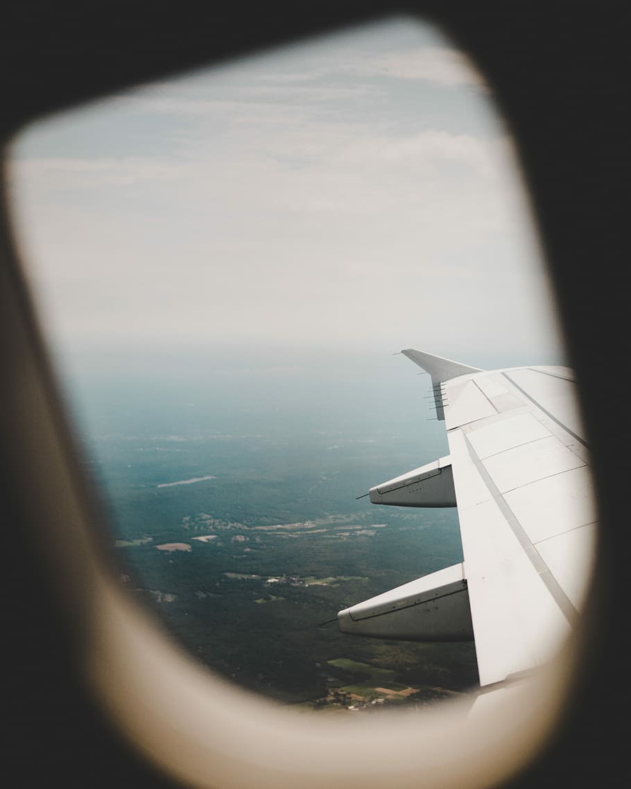 airplane from above, selective focus photography wing of airplane HD wallpaper