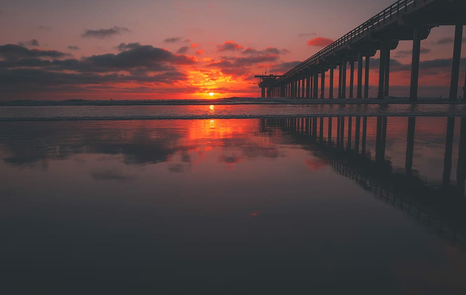 Sunset Surf, low light photo of brown wooden dock during golden hour HD wallpaper