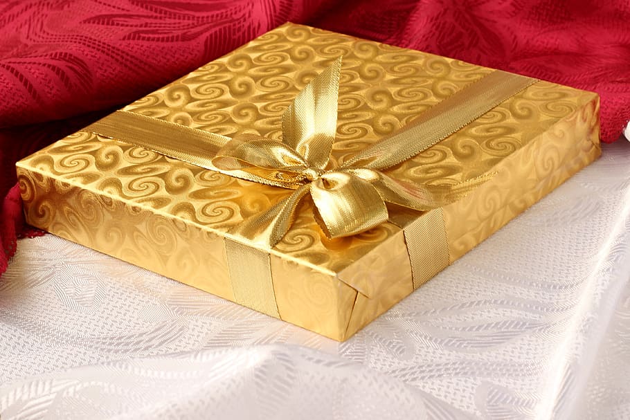gold box with ribbon on white textile, gift, present, background HD wallpaper
