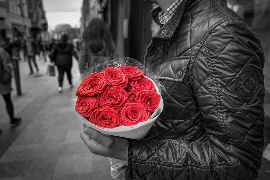 HD wallpaper: selective color photography of man holding bouquet of red