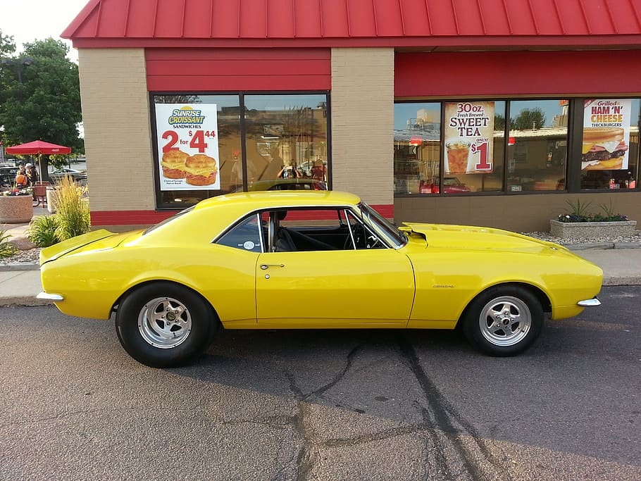 yellow muscle car parked near red building, chevrolet, camaro, HD wallpaper