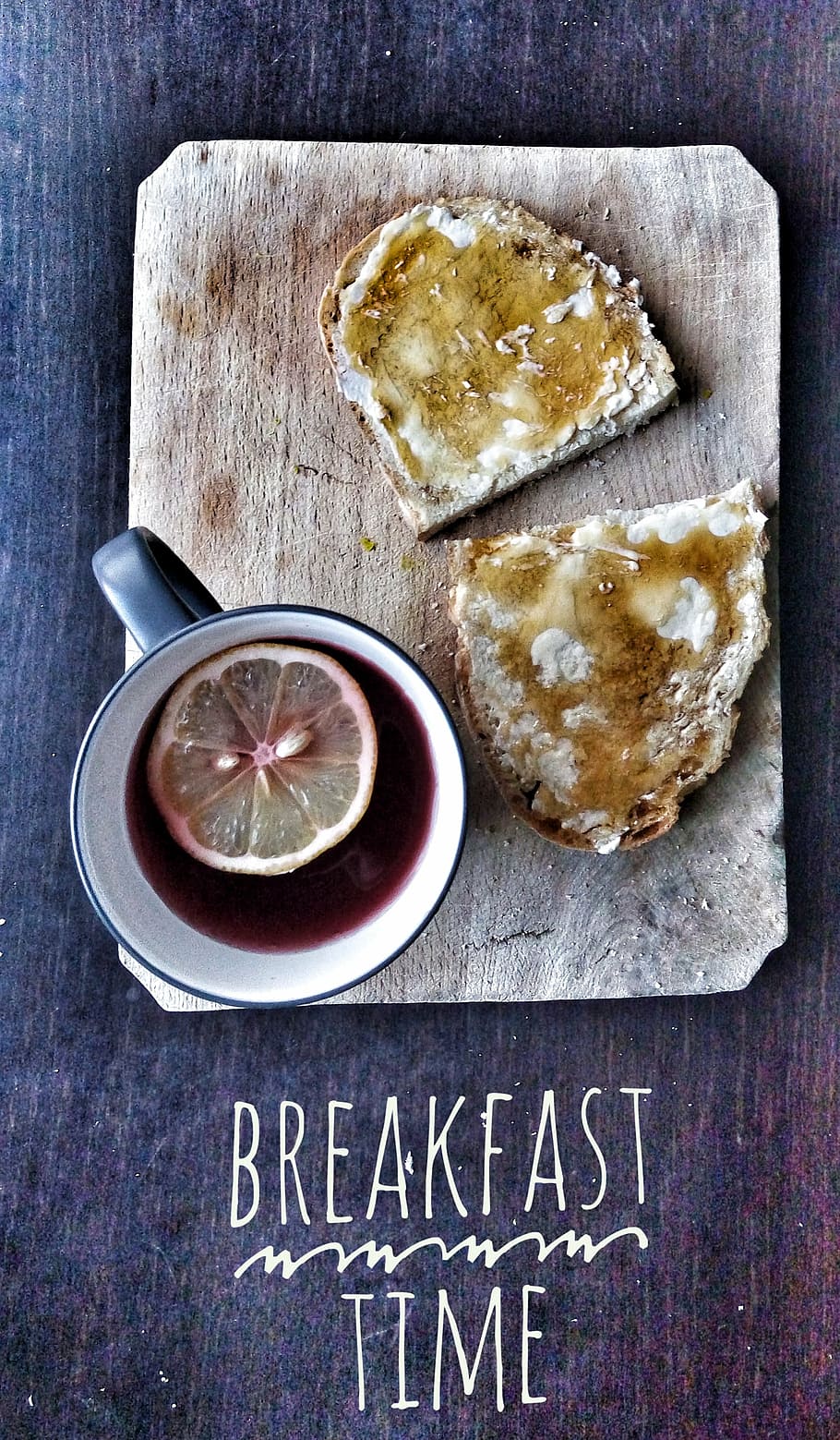 bread and mug filled with red liquid on top of wood slab with breakfast time text overlay HD wallpaper