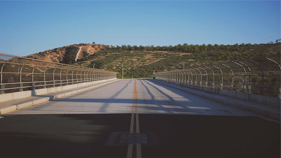 gray concrete fronting green hill, emptied, bridge, near, mountain HD wallpaper