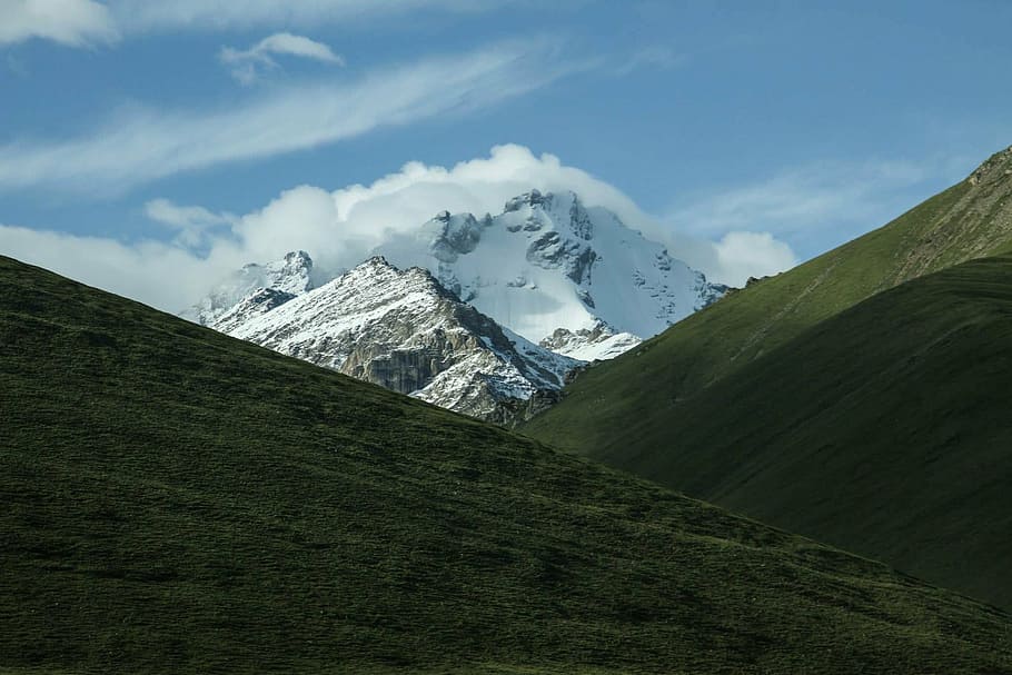 snowy mountain in between green mountains, grass, landscape HD wallpaper