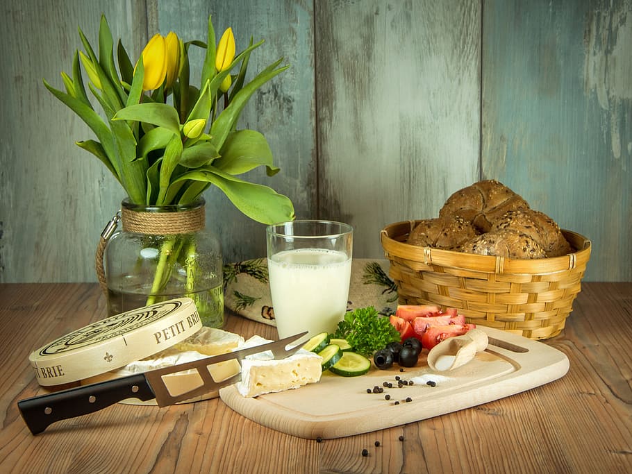 sliced vegetables on chopping board with knife beside glass of milk and basket HD wallpaper