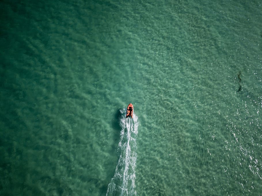 aerial photo of person riding kayak on bodies of water during daytime, bird's eye view of red and white personal watercraft HD wallpaper