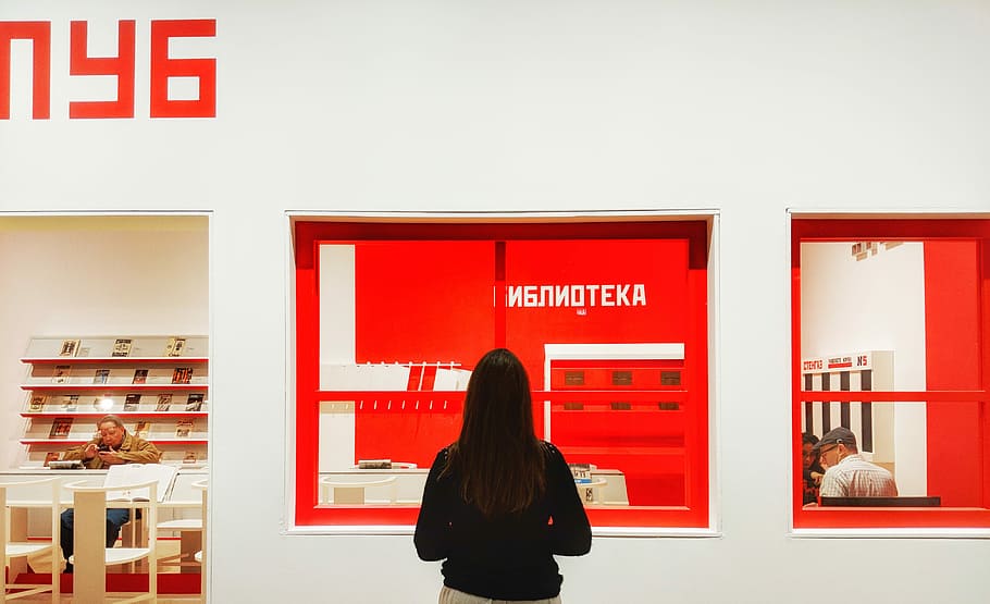 woman looking at poster, wall, building, red, facade, person HD wallpaper
