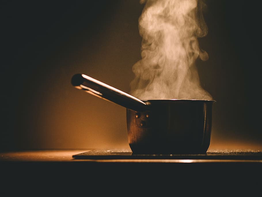 photo of cooking pot on black board, silver, colored, boiling