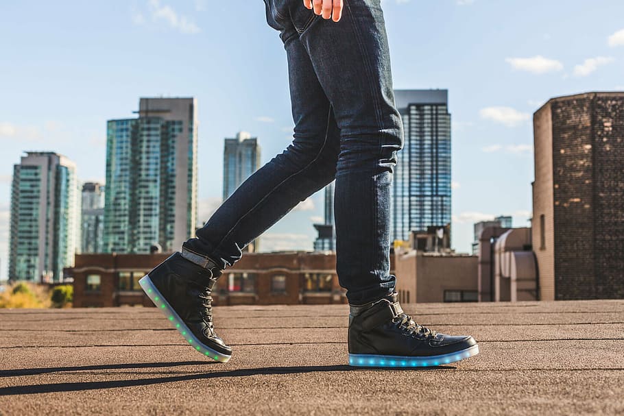 person wearing black-and-blue LED high-top sneakers, architecture HD wallpaper