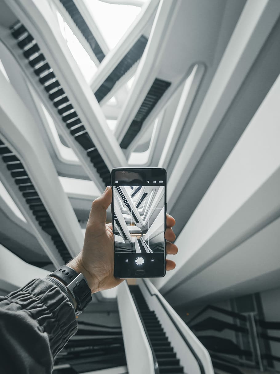 person taking a photo of escalators in building, untitled, screen HD wallpaper