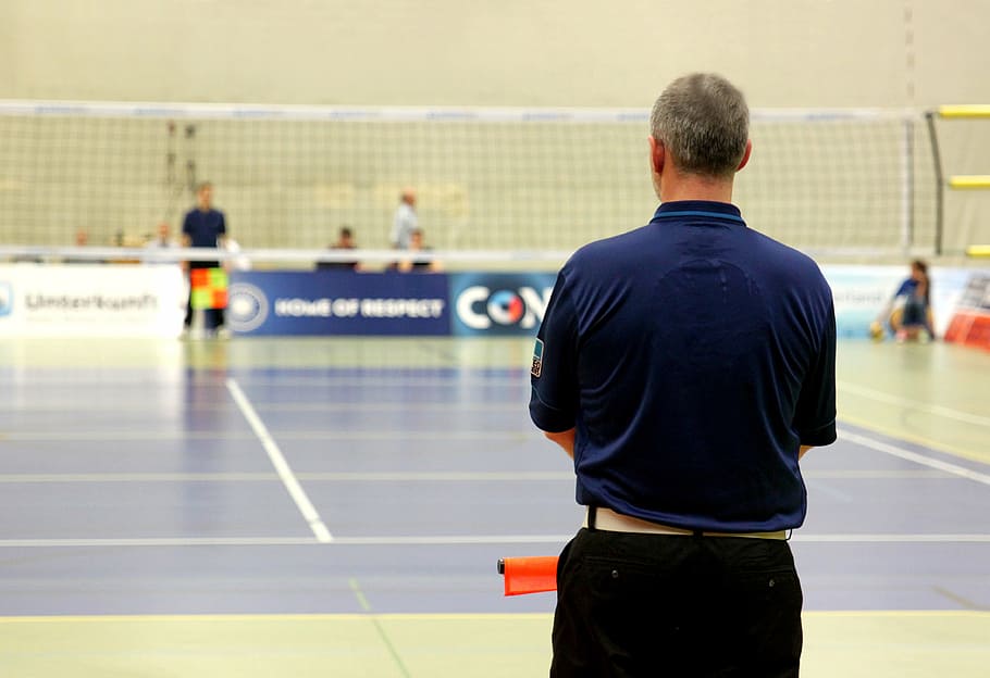 man in front of volleyball net, sport, referee, court of arbitration, HD wallpaper