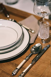 Fancy restaurant dinner table decorated with quail eggs and feathers HD wallpaper