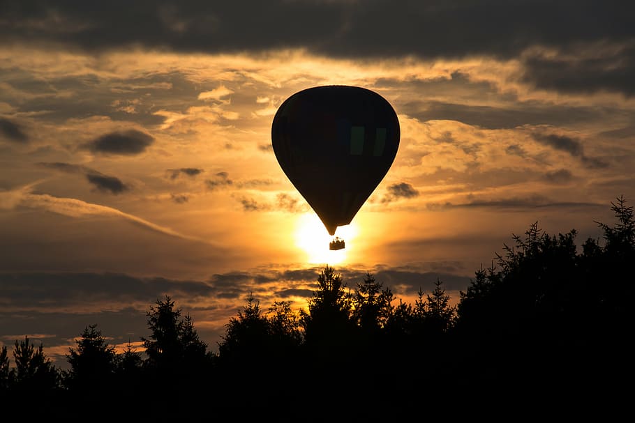 silhouette of hot air balloon during golden hour, balloon flight HD wallpaper