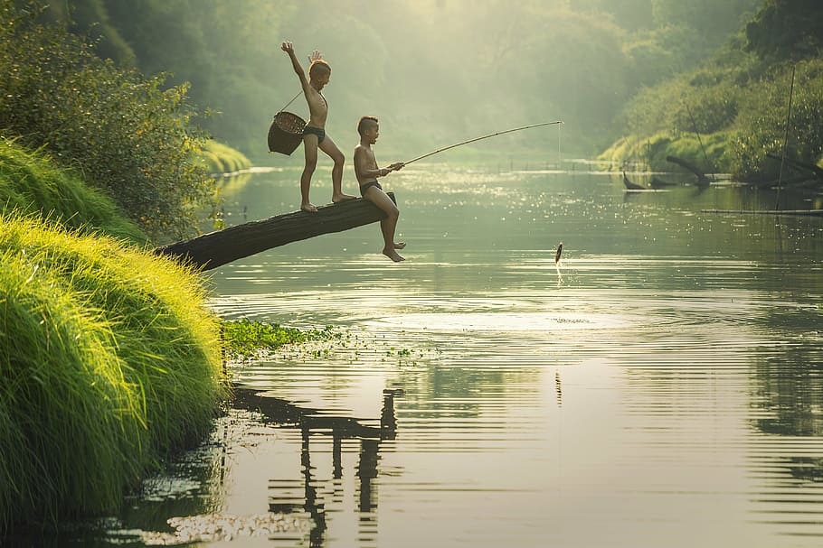 two boys fishing in a river, talented people, the activity, asia