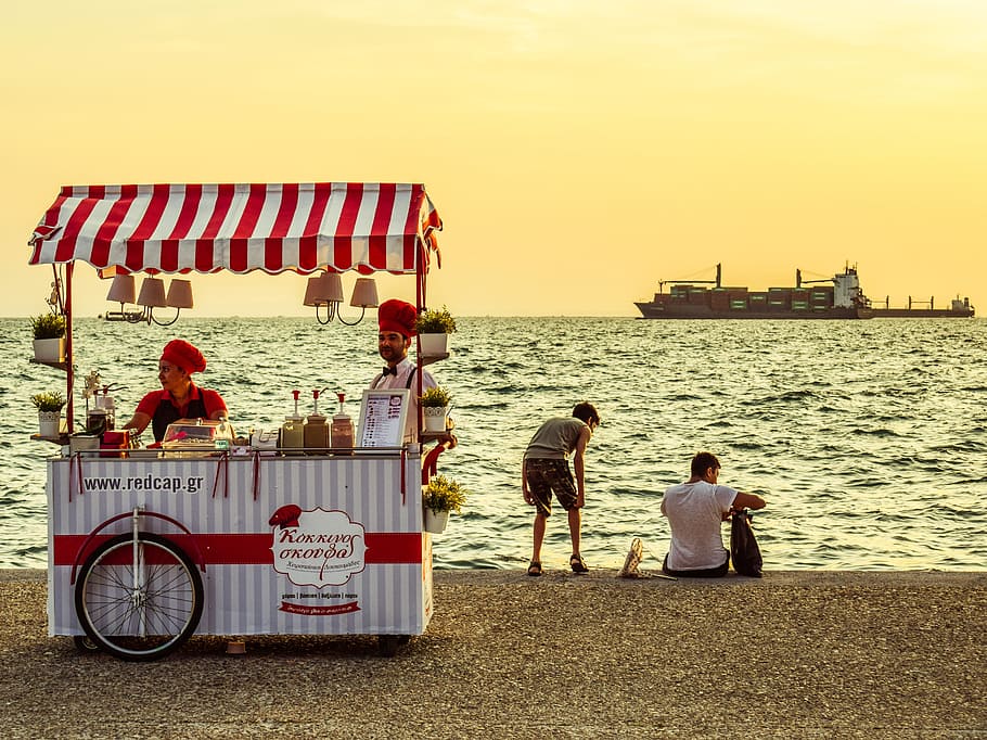 two person standing beside food cart near beach, vendor kiosk, HD wallpaper