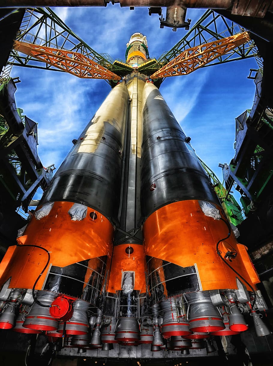 worm's eyeview of orange and white space shuttle, kazakhstan