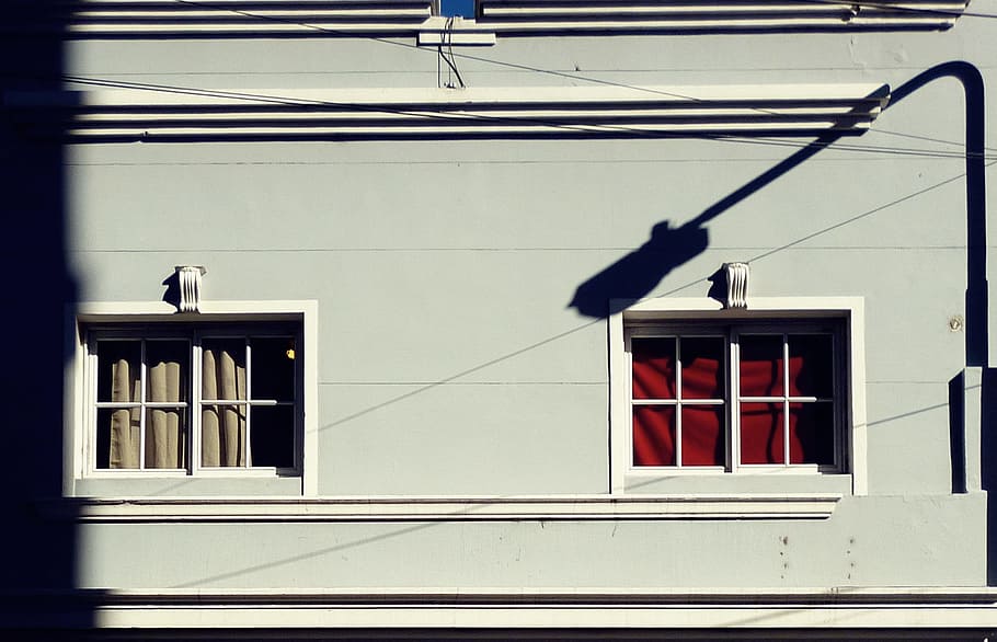 white house window with red curtain and shadow of street post during daytime, blue and white painted concrete house with shadow of streetlight photo during day time HD wallpaper