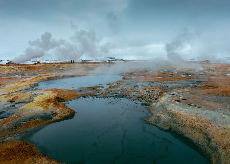 body of water in between of stone, lake under blue sky and white clouds during daytime HD wallpaper