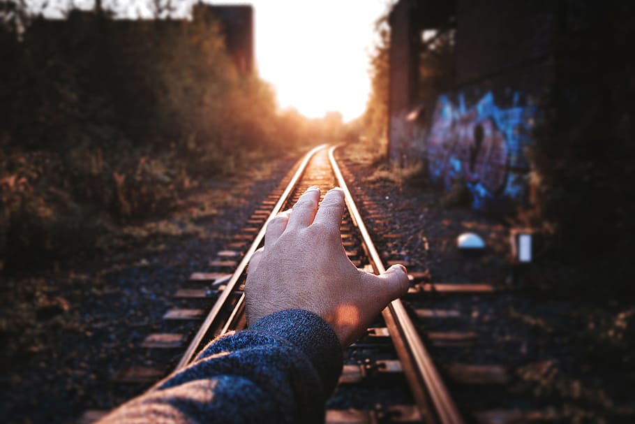 Man’s hand on train tracks, people, travel, railroad Track HD wallpaper