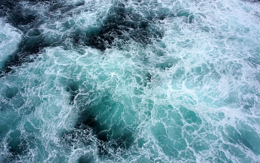 aerial photography of ocean waves, spray, deep sea, dark blue