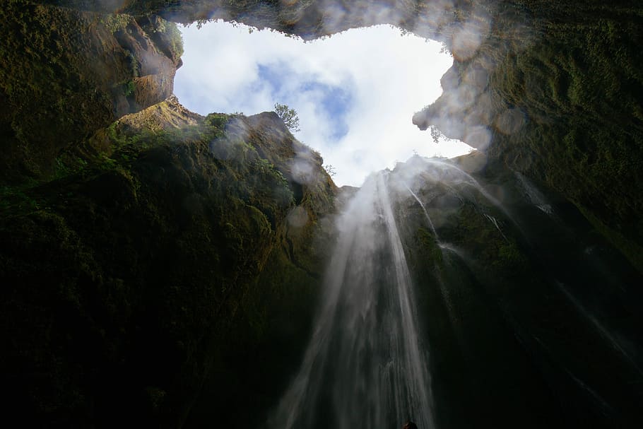 worm's eye view photo of cave waterfalls, worms eye view of mountains with water during daytime HD wallpaper