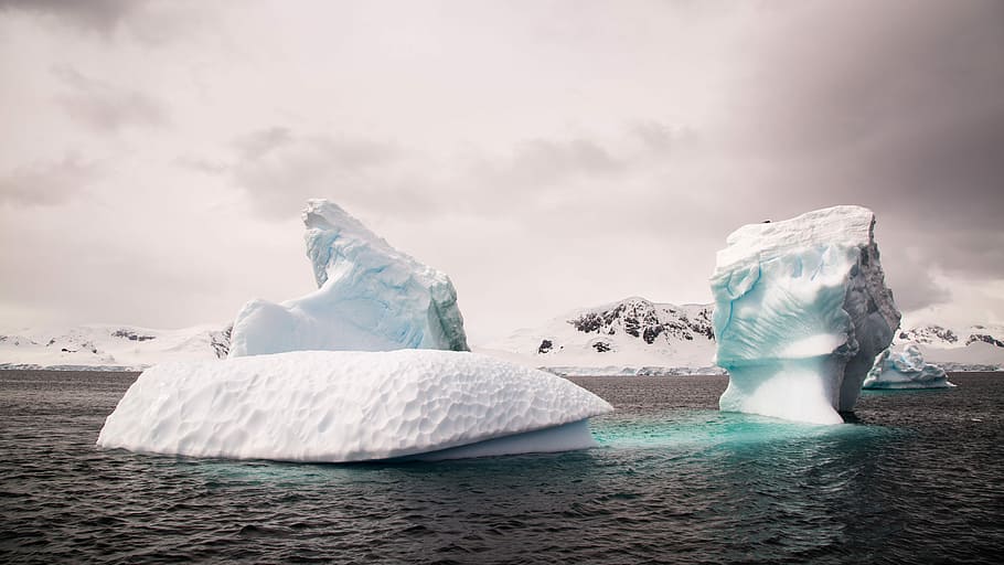 two ice bergs during cloudy day, two icebergs on body of water, HD wallpaper