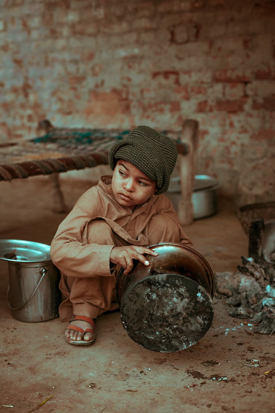 HARD LIFE, boy sitting on the ground while holding pot, kid, 50mm HD wallpaper