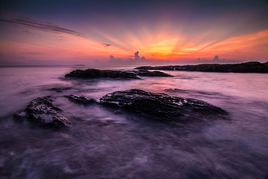 rock formation on body of water at golden hour, sunset, dusk HD wallpaper
