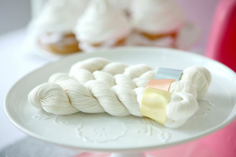 white threads on plate, fabric, sewing, silk, longevity, wool