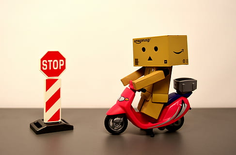 box man riding motor scooter with stop road sign toy, danbo HD wallpaper