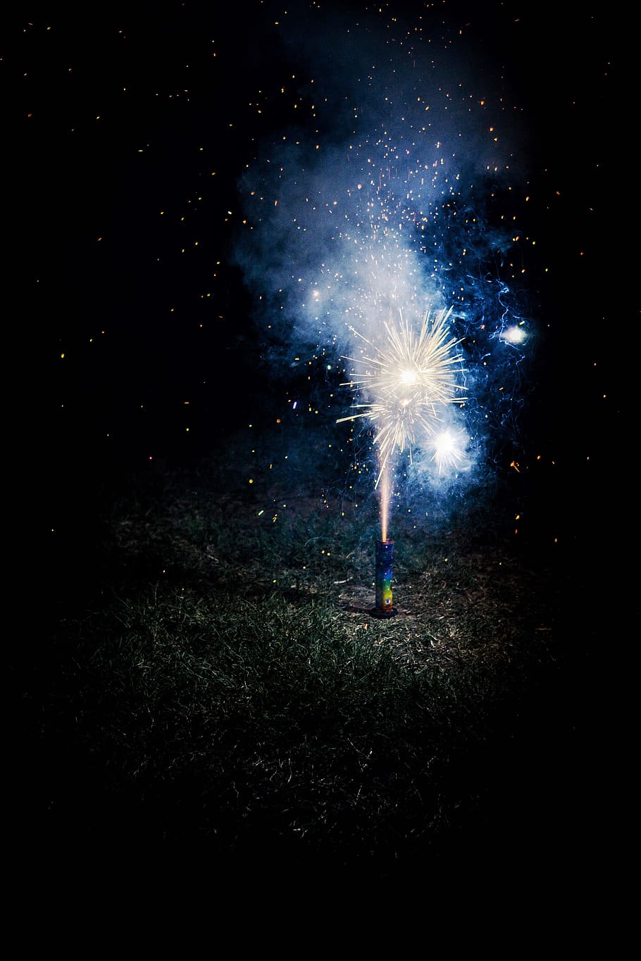 photo of lighted firecracker on ground during night time, exploding HD wallpaper