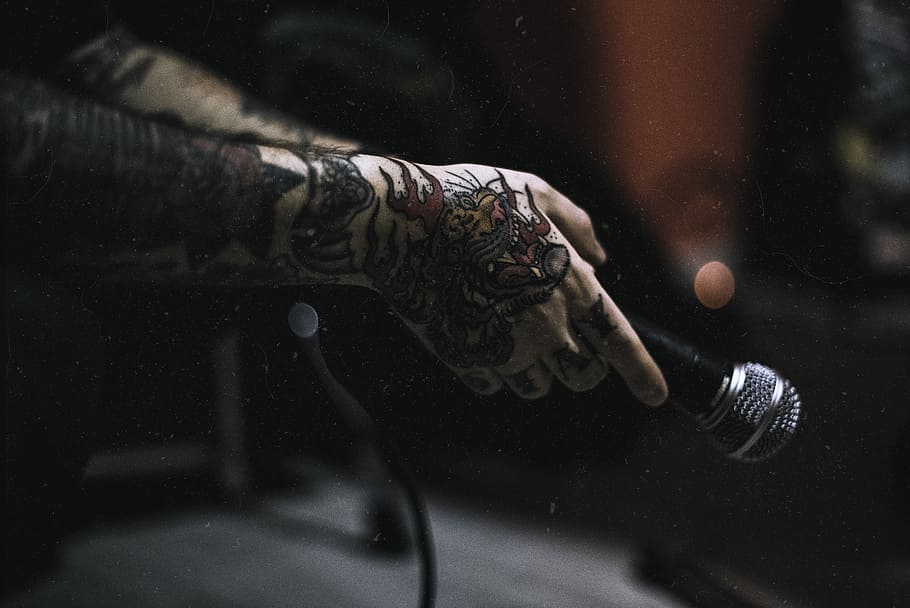 HD wallpaper: tattooed person holding microphone, person holding microphone  | Wallpaper Flare